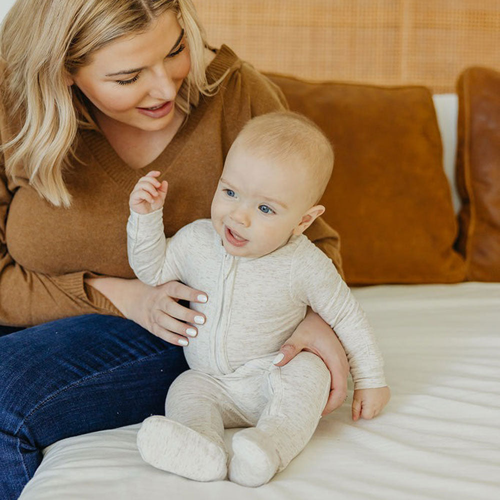 Baby wearing Copper Pearl Zip-up Footie - Oat