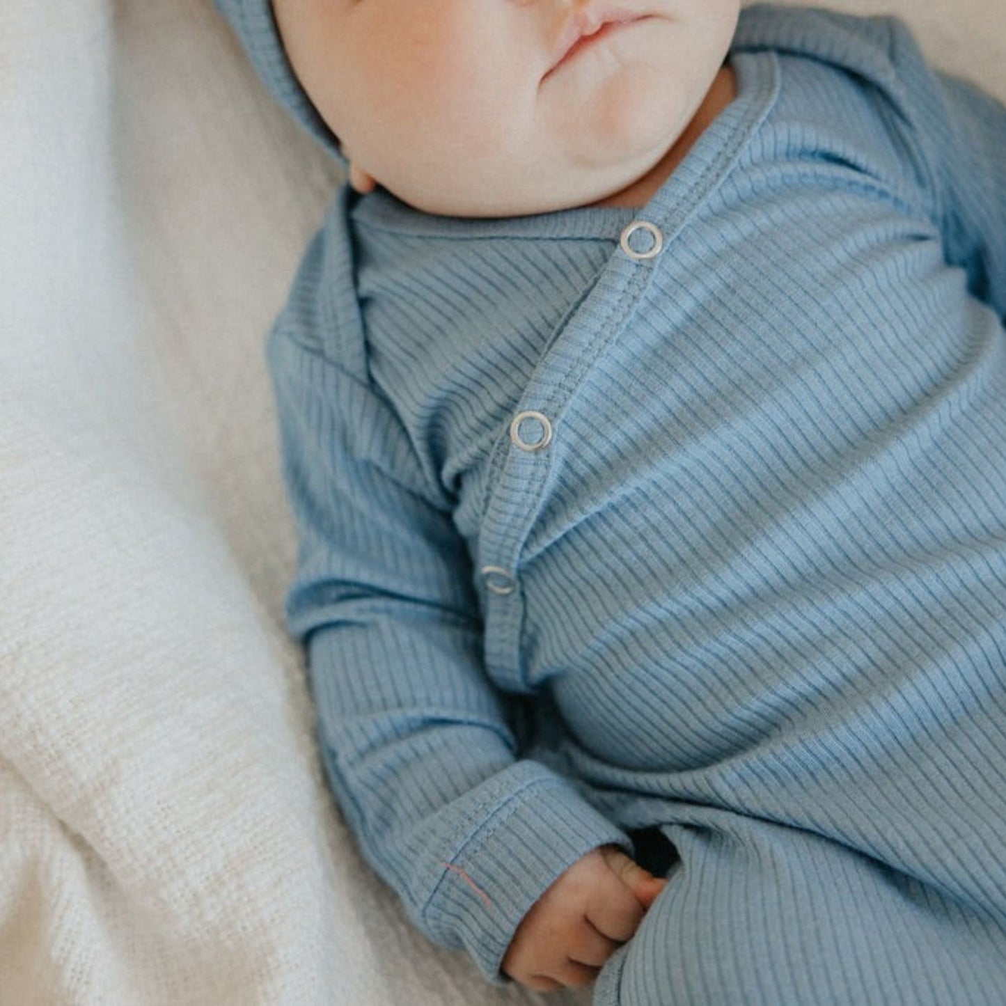 Baby girl wearing Copper Pearl Rib Knit Newborn Knotted Gown - Atlantic