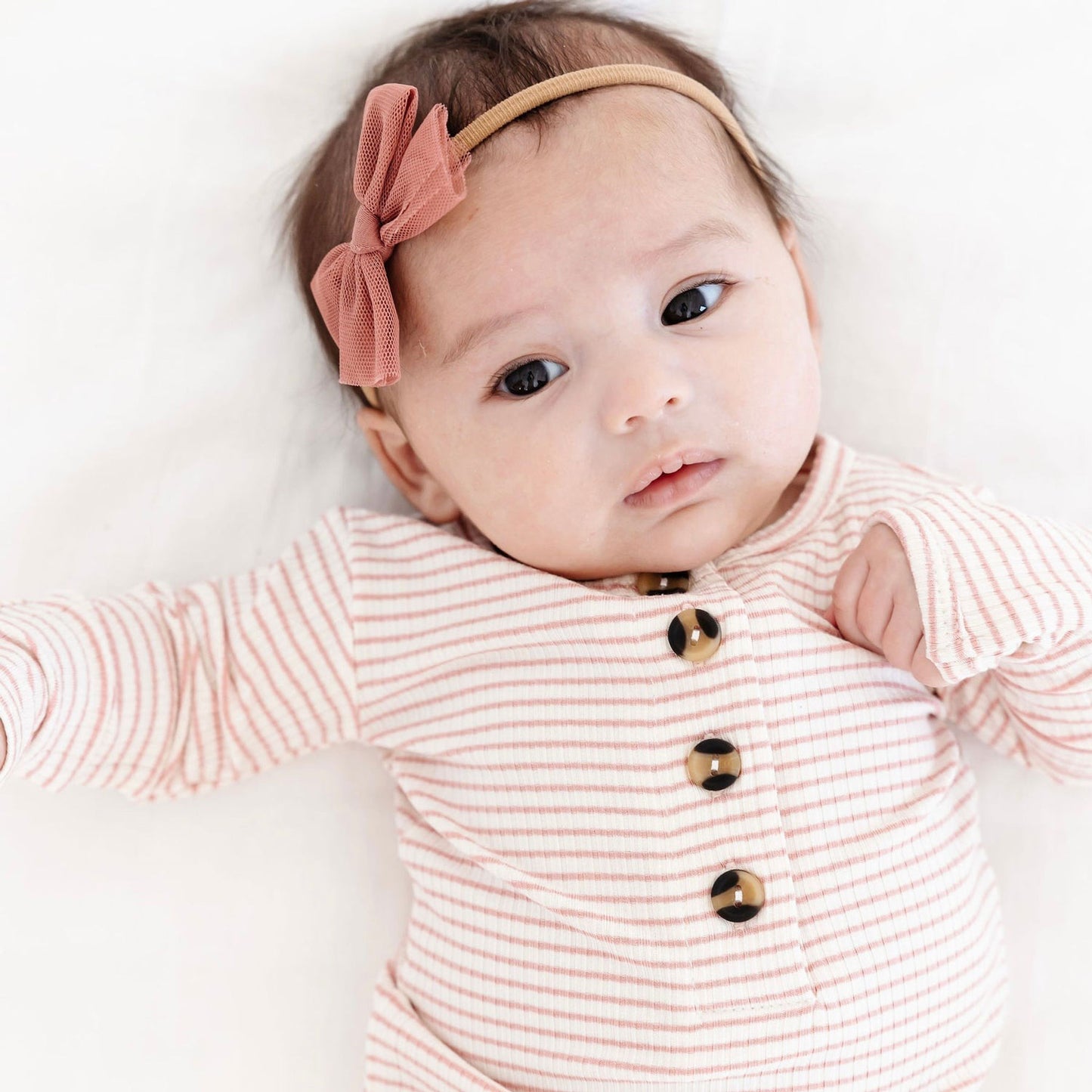 Baby wearing Lou Lou and Company Ribbed Knotted Gown - Hannah