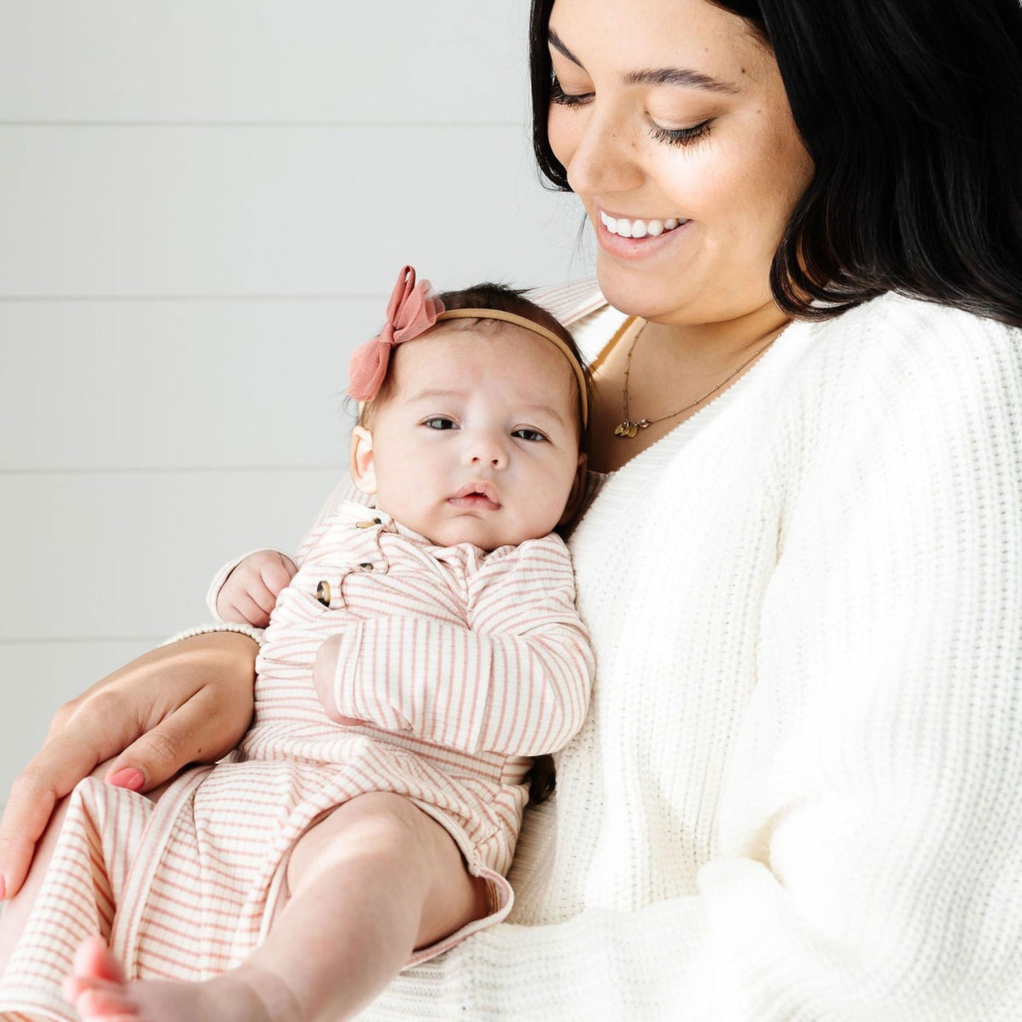 Mom holding a baby wearing Lou Lou and Company Ribbed Knotted Gown - Hannah
