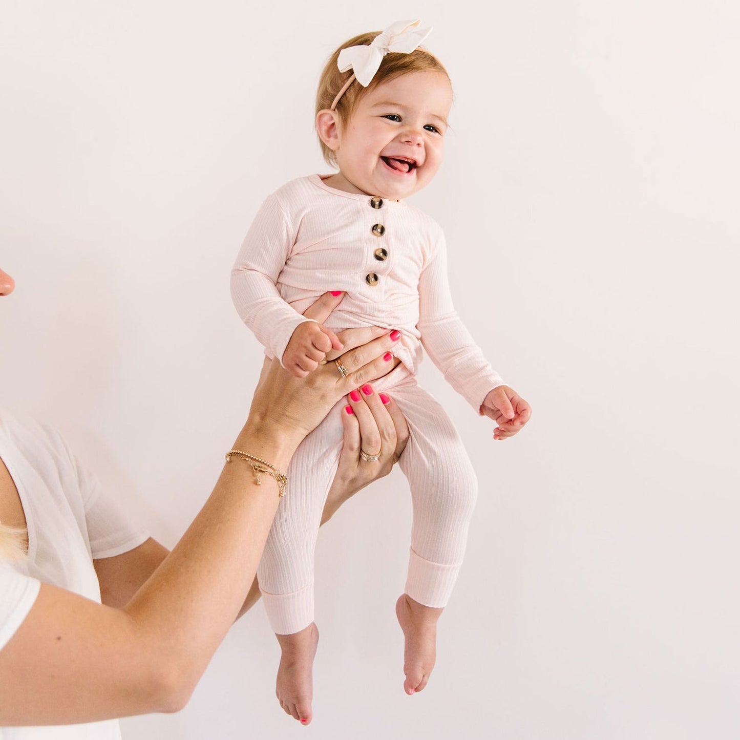 Mom holds toddler wearing Lou Lou and Company Ribbed Top and Bottoms - Rosie