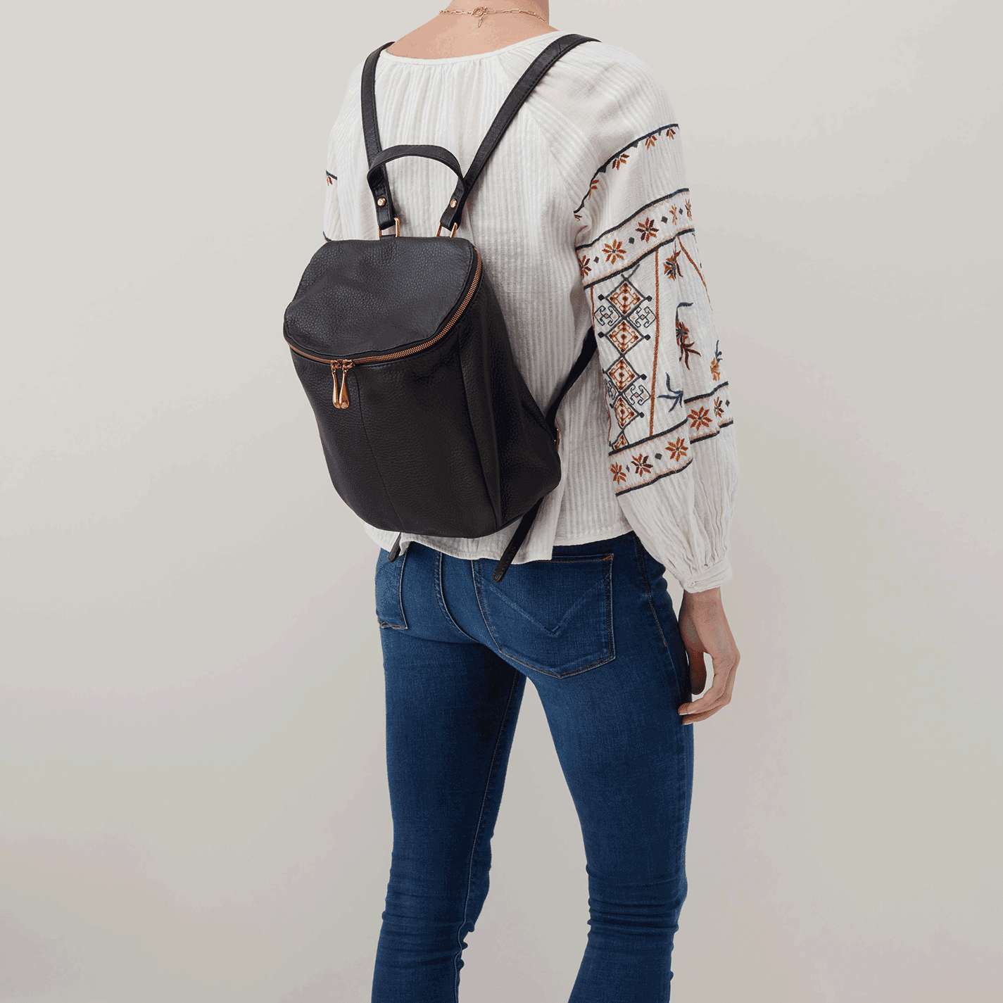 Woman Wearing Hobo Bags River Backpack - Velvet Pebbled Hide - Black