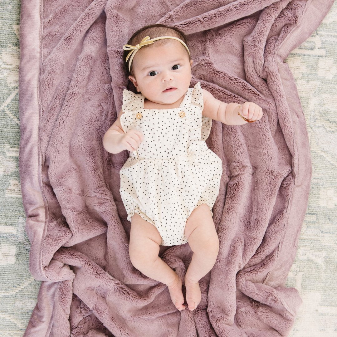Baby laying on Saranoni Receiving Lush Blanket - Bloom