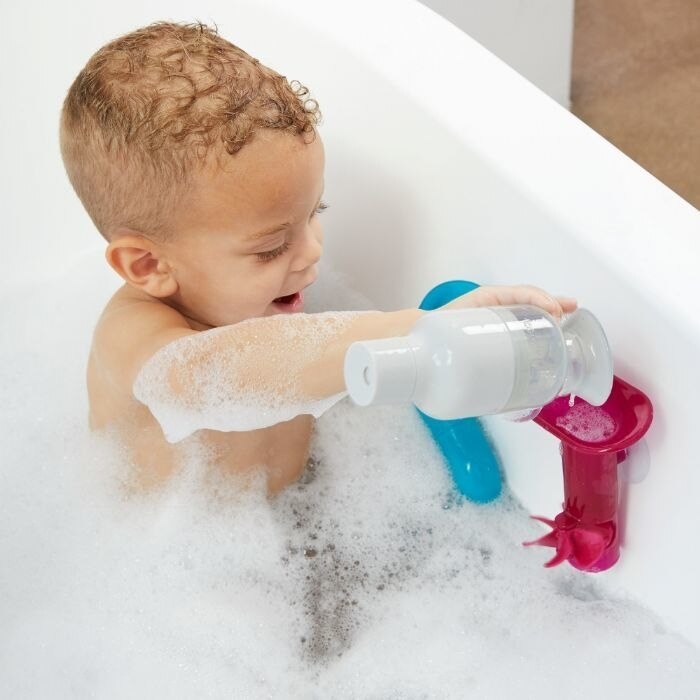 Child Playing in Bath with Boon TUBES Building Bath Toy Set - Pink Multi