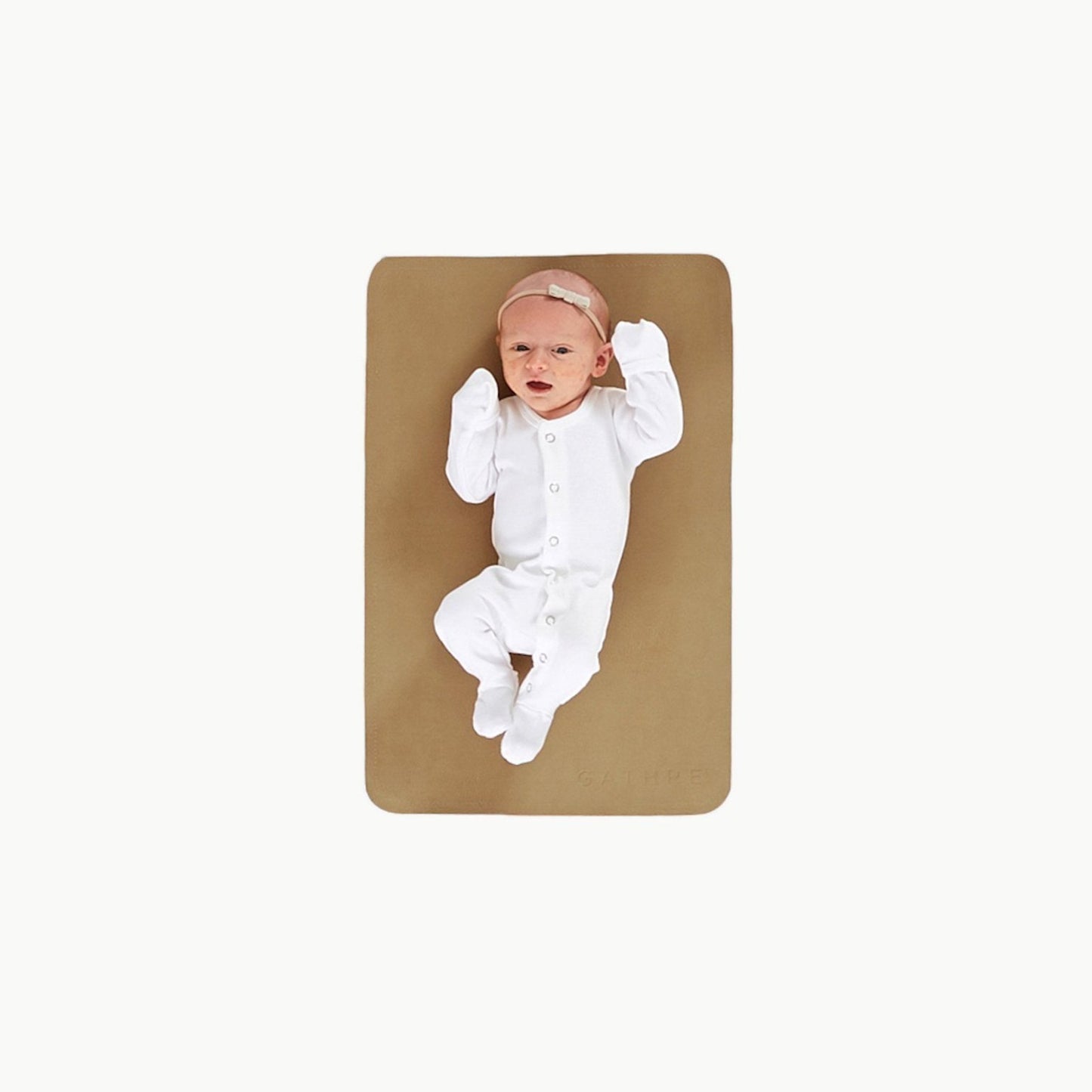 Newborn baby lying on Gathre Micro Mat - Camel
