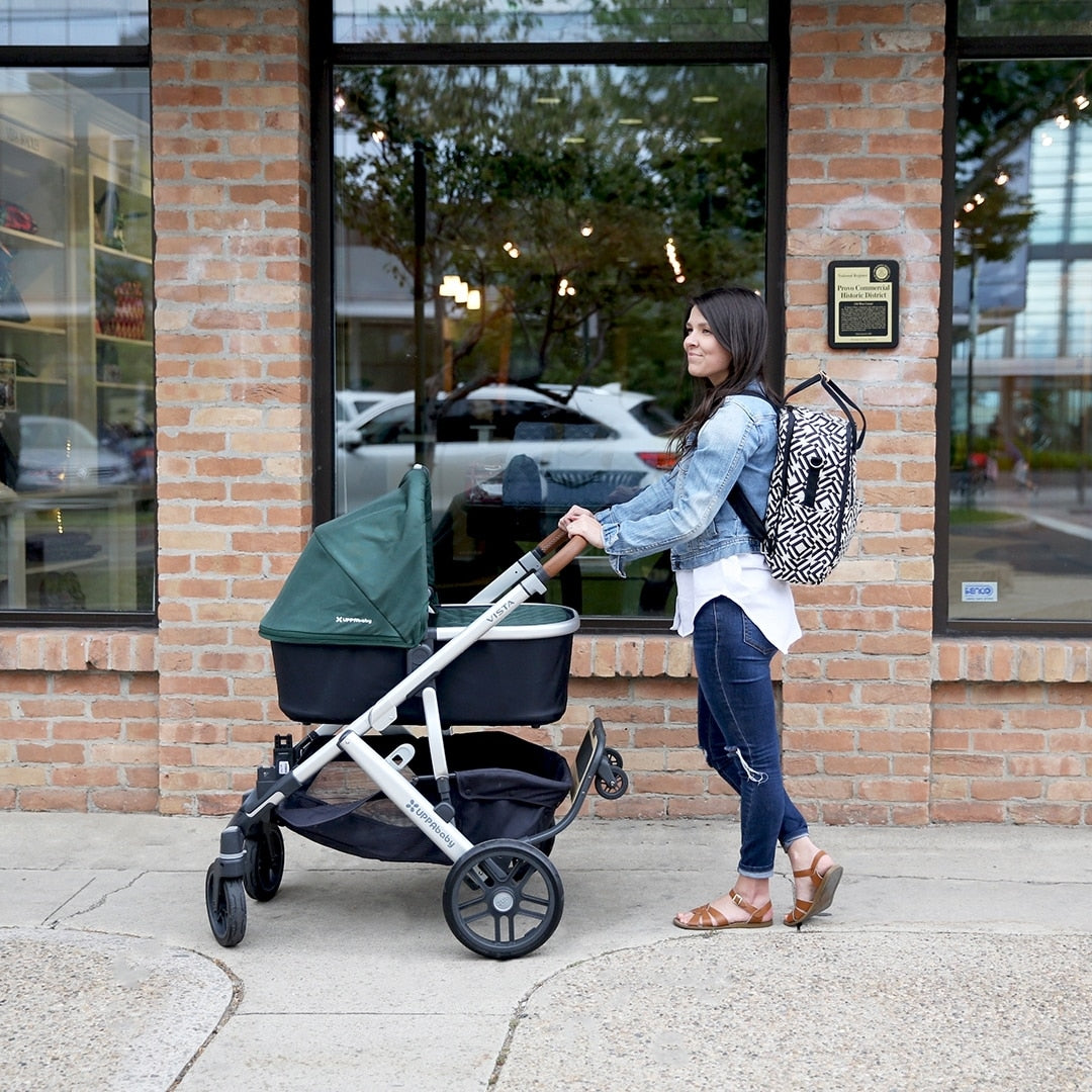 Woman pushing stroller with UPPAbaby PiggyBack - VISTA