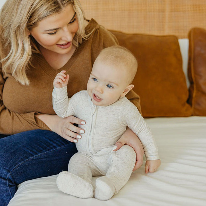 Baby wearing Copper Pearl Zip-up Footie - Oat
