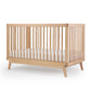 Baby sleeping in Dadada Soho 3-in-1 Convertible Crib - Natura;