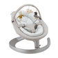 Girls sits in Nuna LEAF Grow - Driftwood