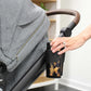 Woman putting cup into Romer Tura Stroller Cup Holder