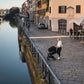 Mom exploring Europe while baby rides in Nuna TRVL LX Stoller and PIPA Urbn Car Seat Travel System - Caviar