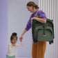 Woman carries Bugaboo Butterfly Complete Stroller