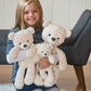 Little girl holds Mary Meyer Putty Bear - Cream - All sizes