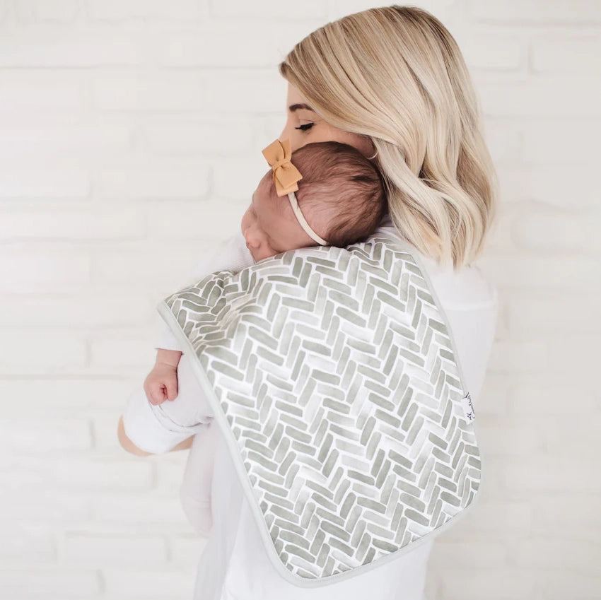 Woman holds baby with Copper Pearl 3-Pack Burp Cloth Set - Alta