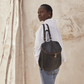 Woman Wearing Hobo Bags River Backpack - Velvet Pebbled Hide - Black