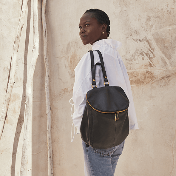 Woman Wearing Hobo Bags River Backpack - Velvet Pebbled Hide - Black