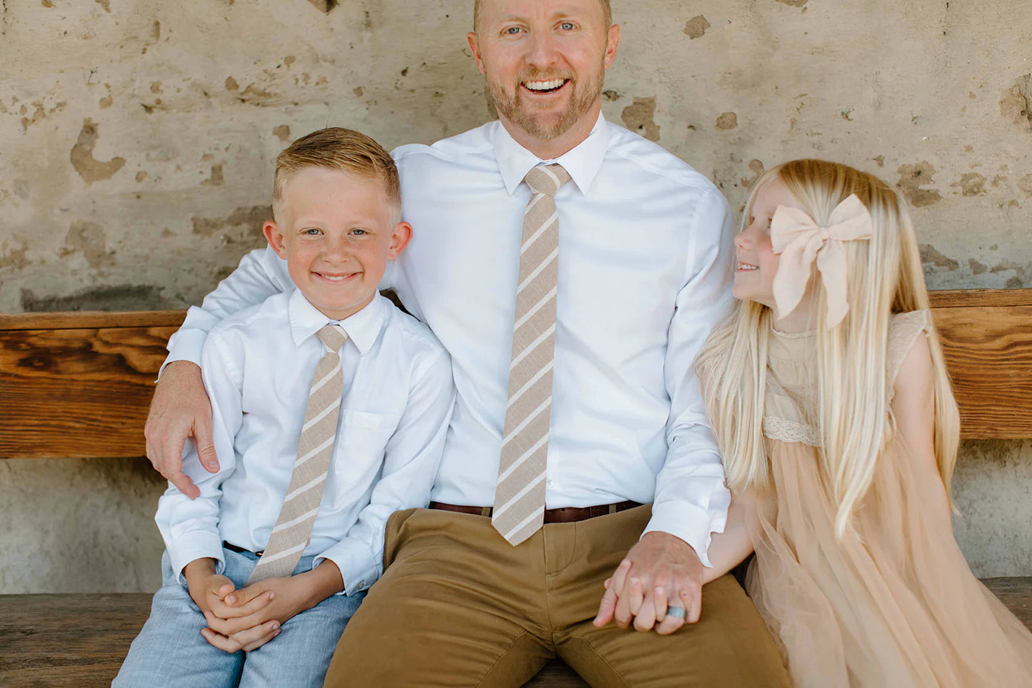 Father sits with daughter and son who is wearing Boon Ties Boys' Tie - La Jolla