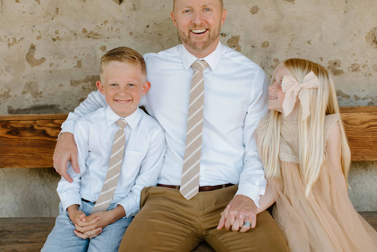 Father sits with daughter and son who is wearing Boon Ties Boys' Tie - La Jolla