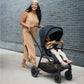Woman pushes Nuna TRIV Next Stroller