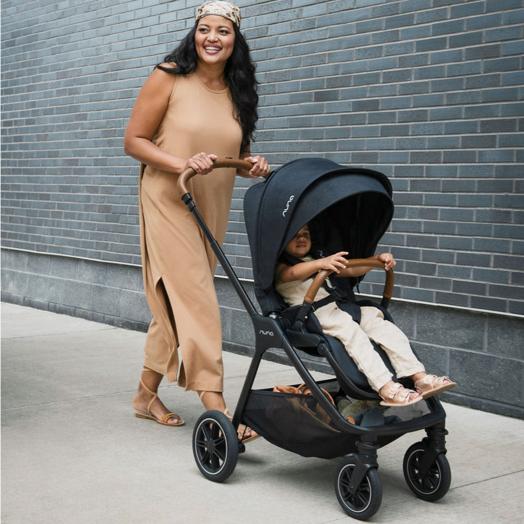 Woman pushes Nuna TRIV Next Stroller