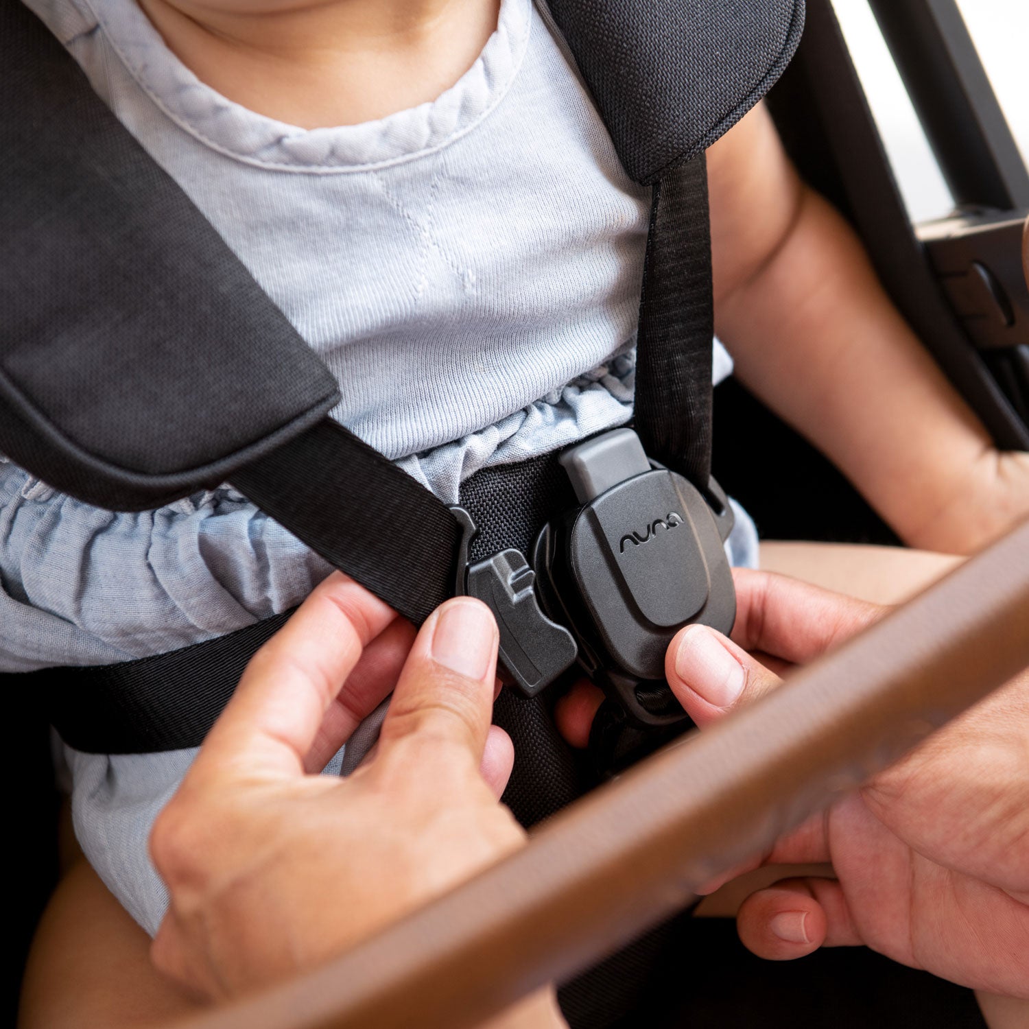 Nuna TRVL Stroller buckle close-up