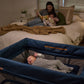 Baby asleep in UPPAbaby REMI Playard - Noa