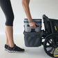Woman putting item in Veer Cruiser Foldable Storage Basket