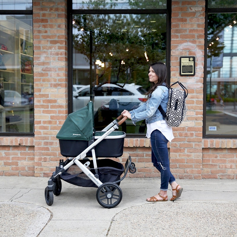 Woman pushing stroller with UPPAbaby PiggyBack - VISTA