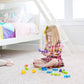 Child Playing with Fat Brain Toys Squigz Starter Set