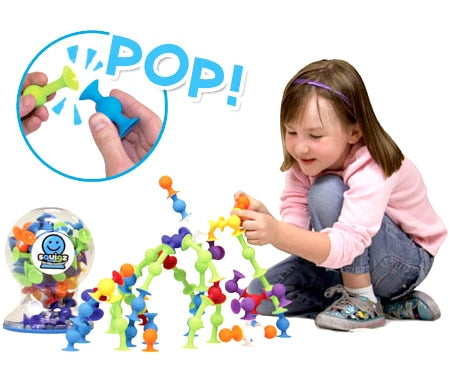 Child Playing with Fat Brain Toys Squigz Deluxe Toy Set