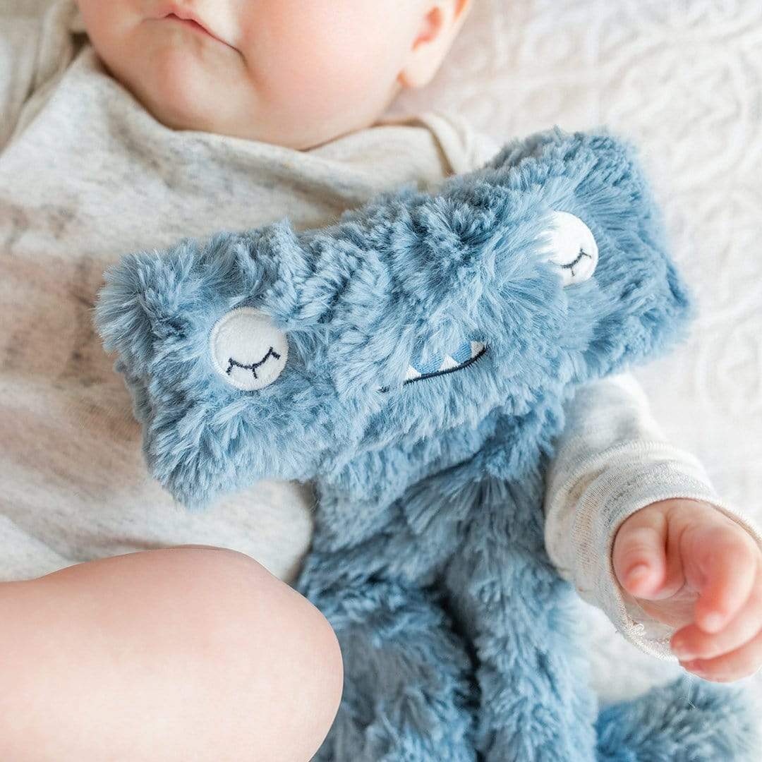 Baby snuggling Slumberkins Hammerhead Snuggler - Pacific / Blue
