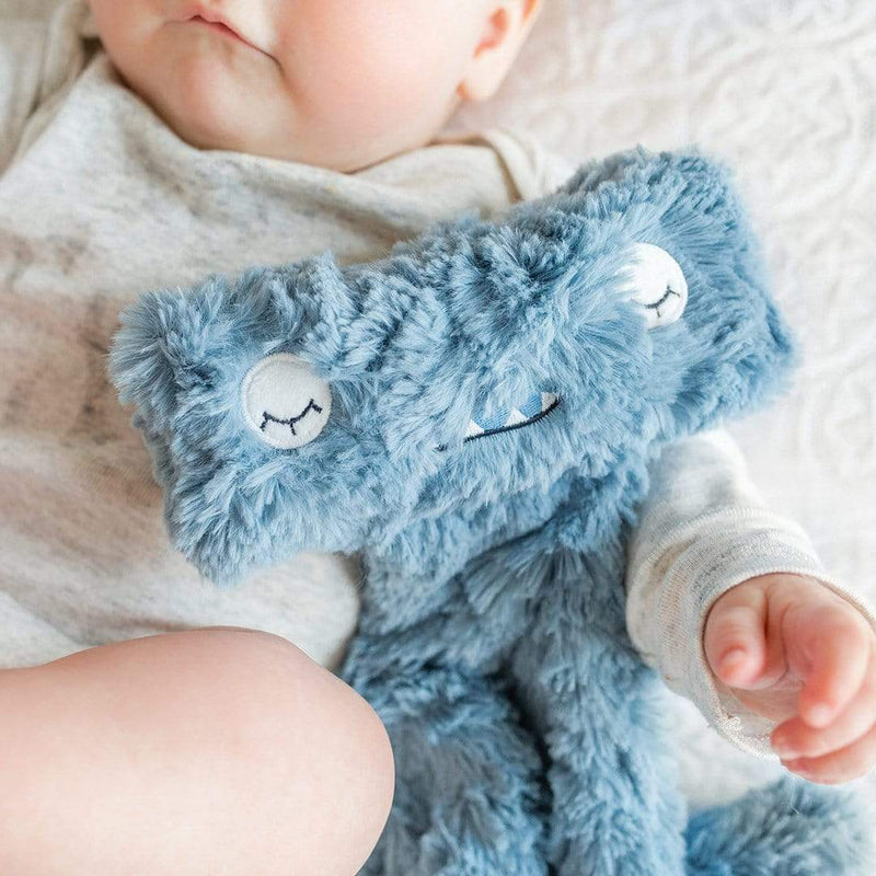 Baby snuggling Slumberkins Hammerhead Snuggler - Pacific / Blue