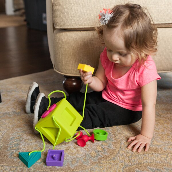Child Playing with Fat Brain Toys OombeeCube
