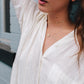 Woman Wearing Made by Mary Gold Filled Mini Zola Disc Necklace - April / Daisy